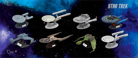 Assortment of eight Star Trek ships in Qraftworks puzzlefleet against a galaxy background